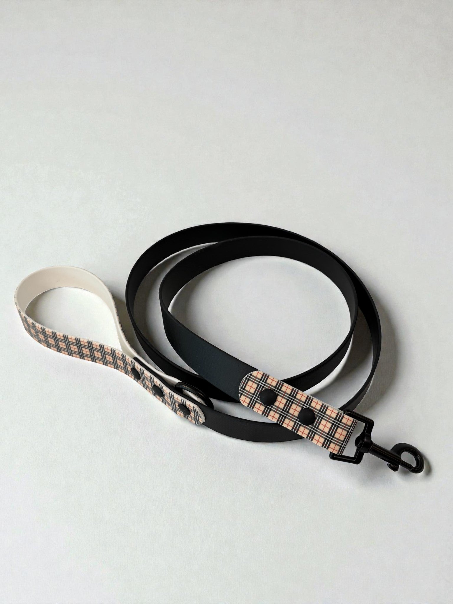 Dog leash with plaid pattern on a white background