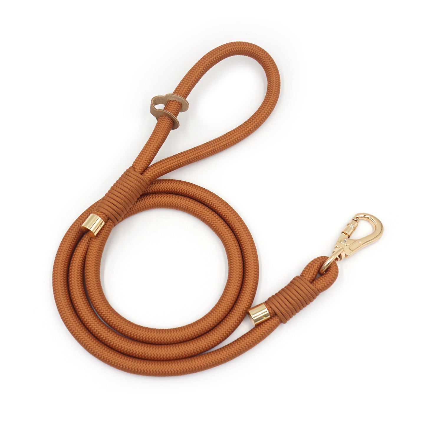 Warm brown rope dog leash with gold clasp on a white background