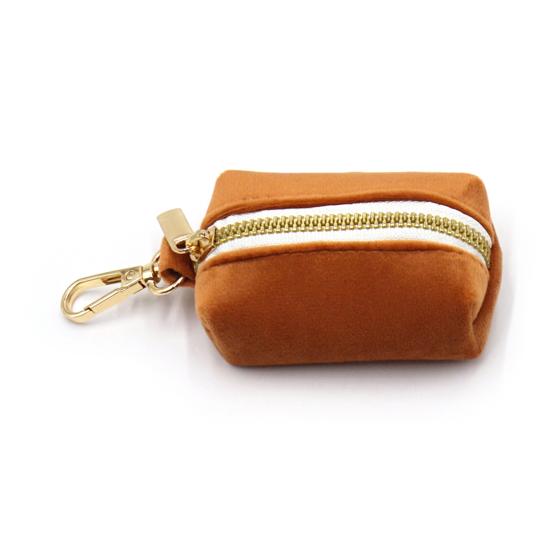 Brown velvet poop bag dispenser with gold zipper and keychain on a white background