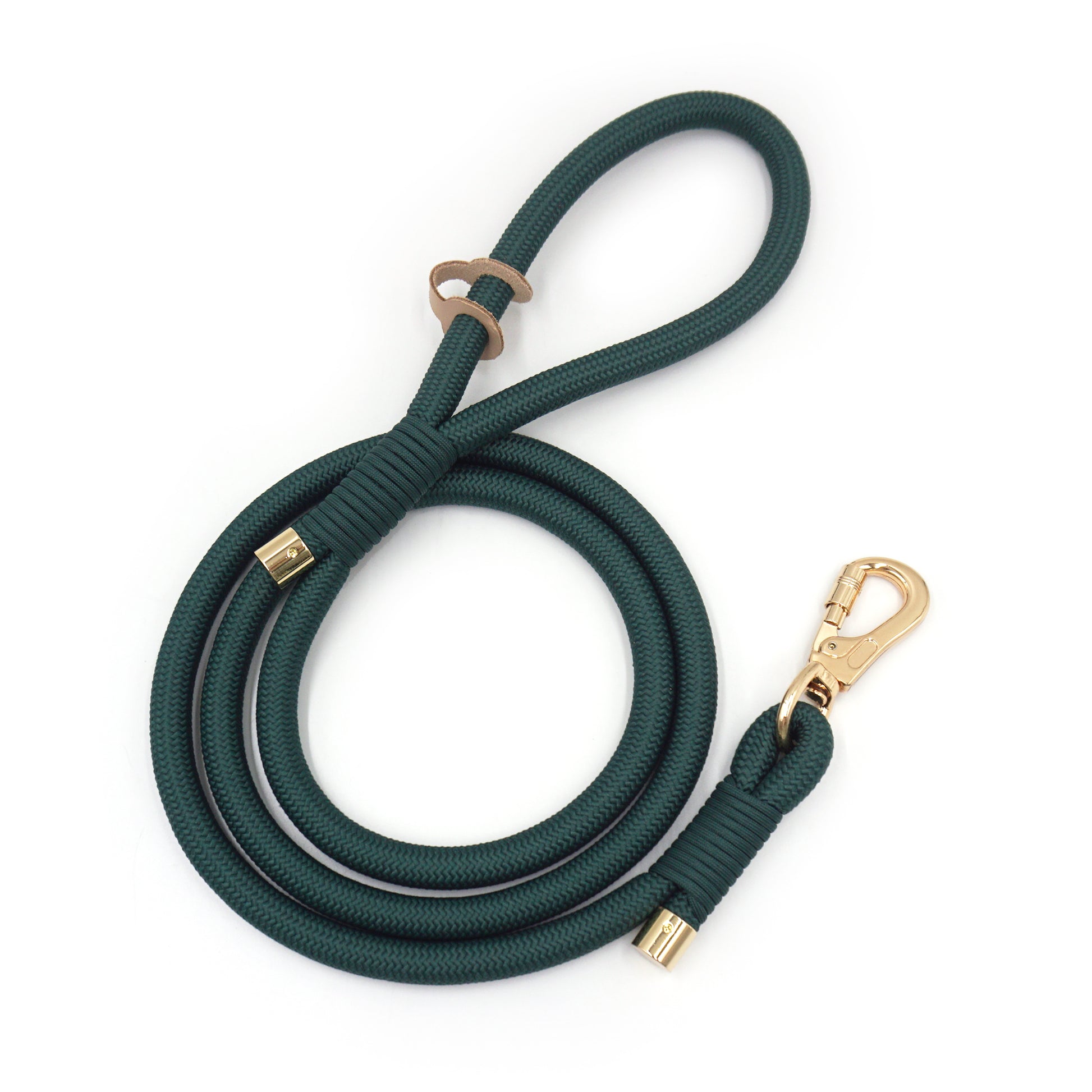 Deep green rope dog leash with gold hardware on a white background