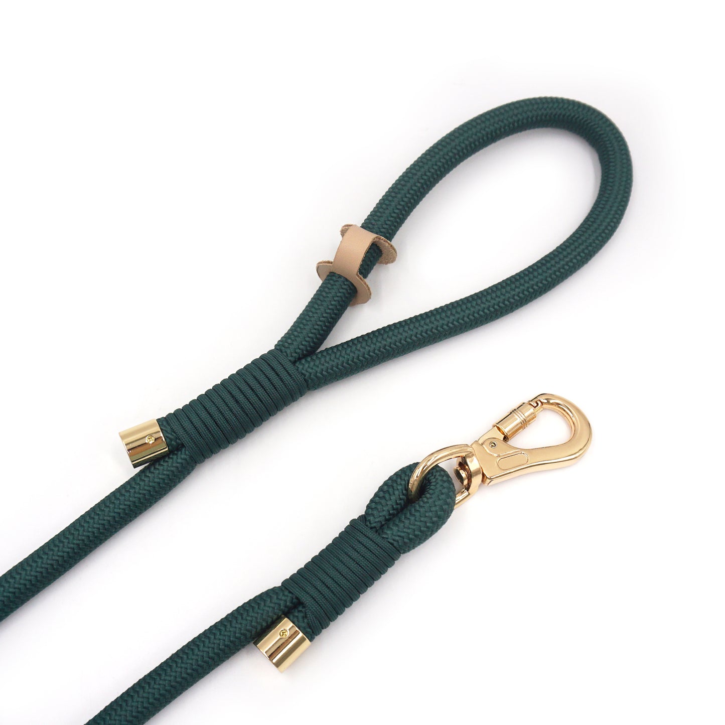 Deep green rope dog leash with gold hardware on a white background