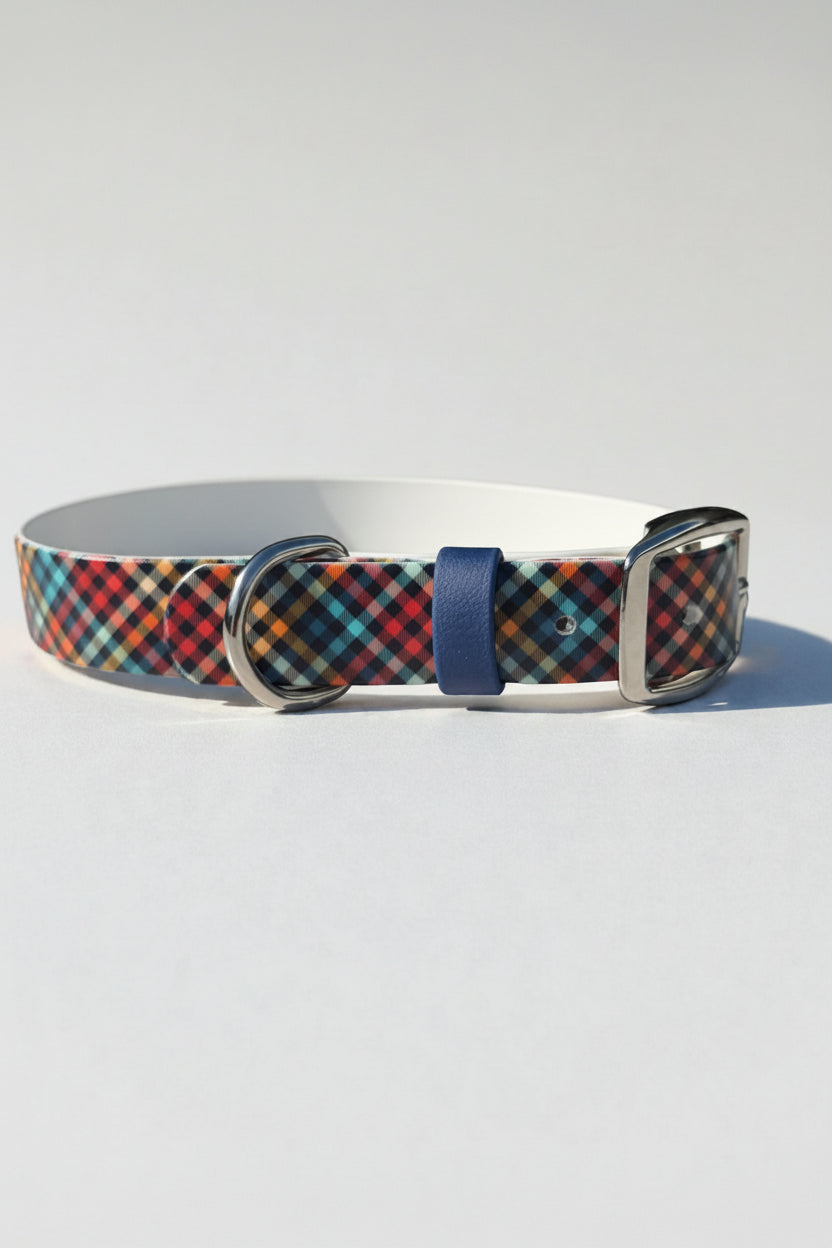 Plaid dog collar with a blue accent on a light gray background