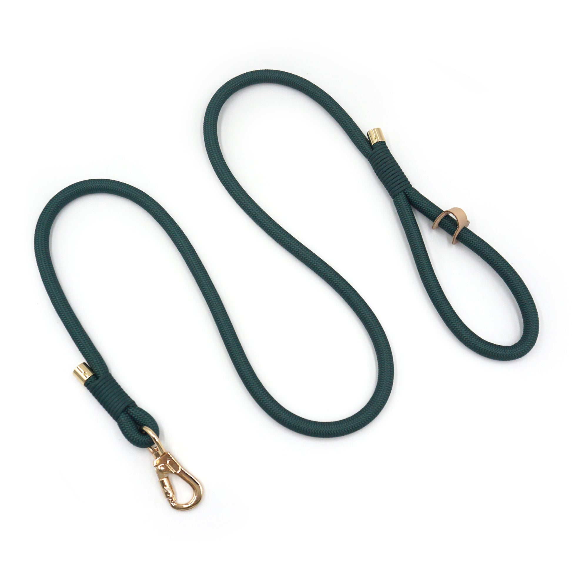 Deep green rope dog leash with gold hardware on a white background