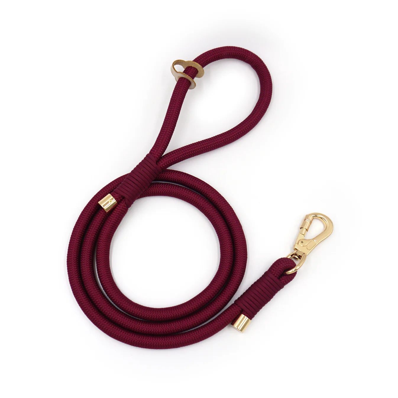 Burgundy rope dog leash with gold hardware on a white background